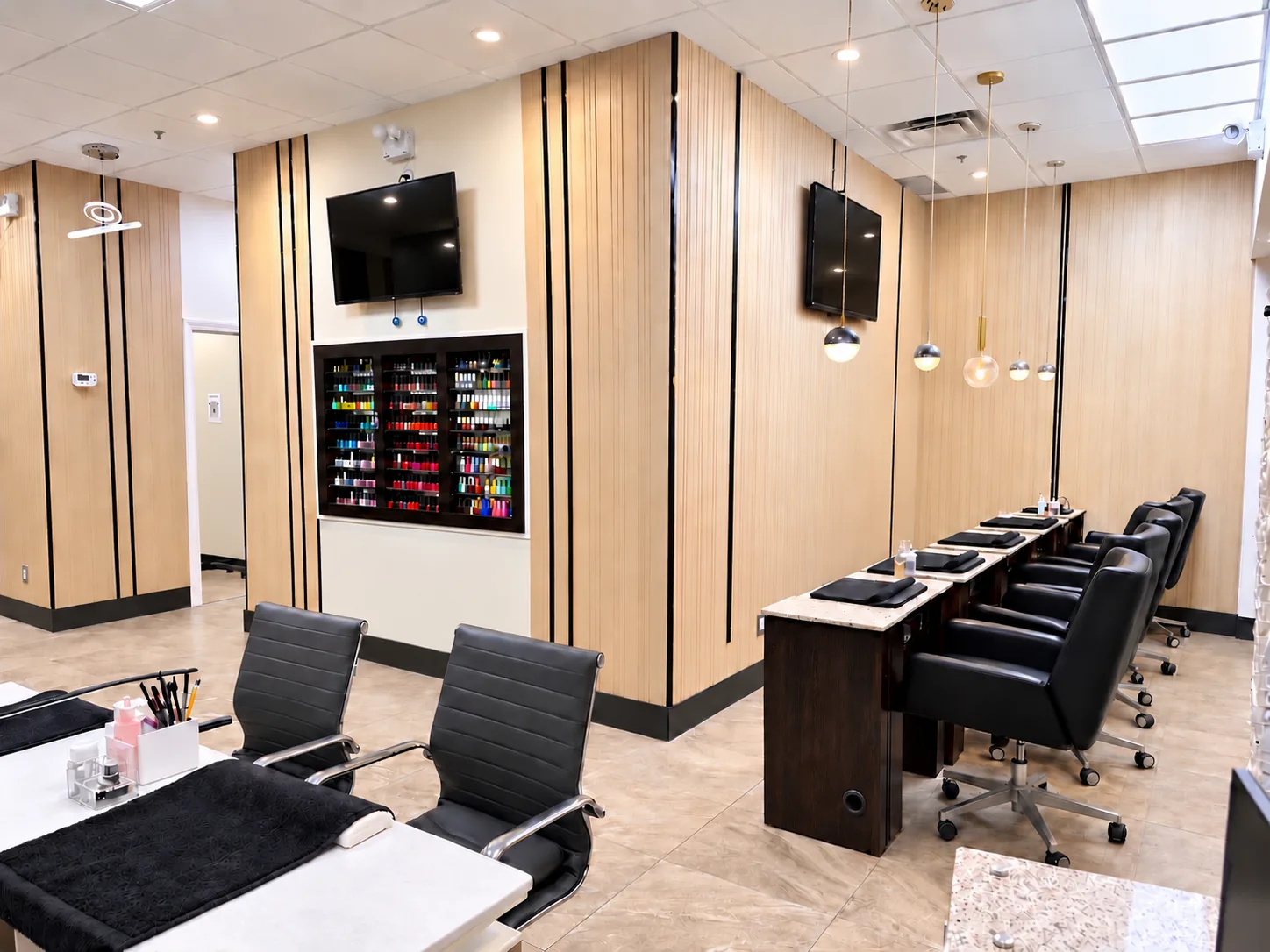 Inside Beautique Bar at Bridlewood Mall: manicure stations, the colour wall and wood-slat walls
