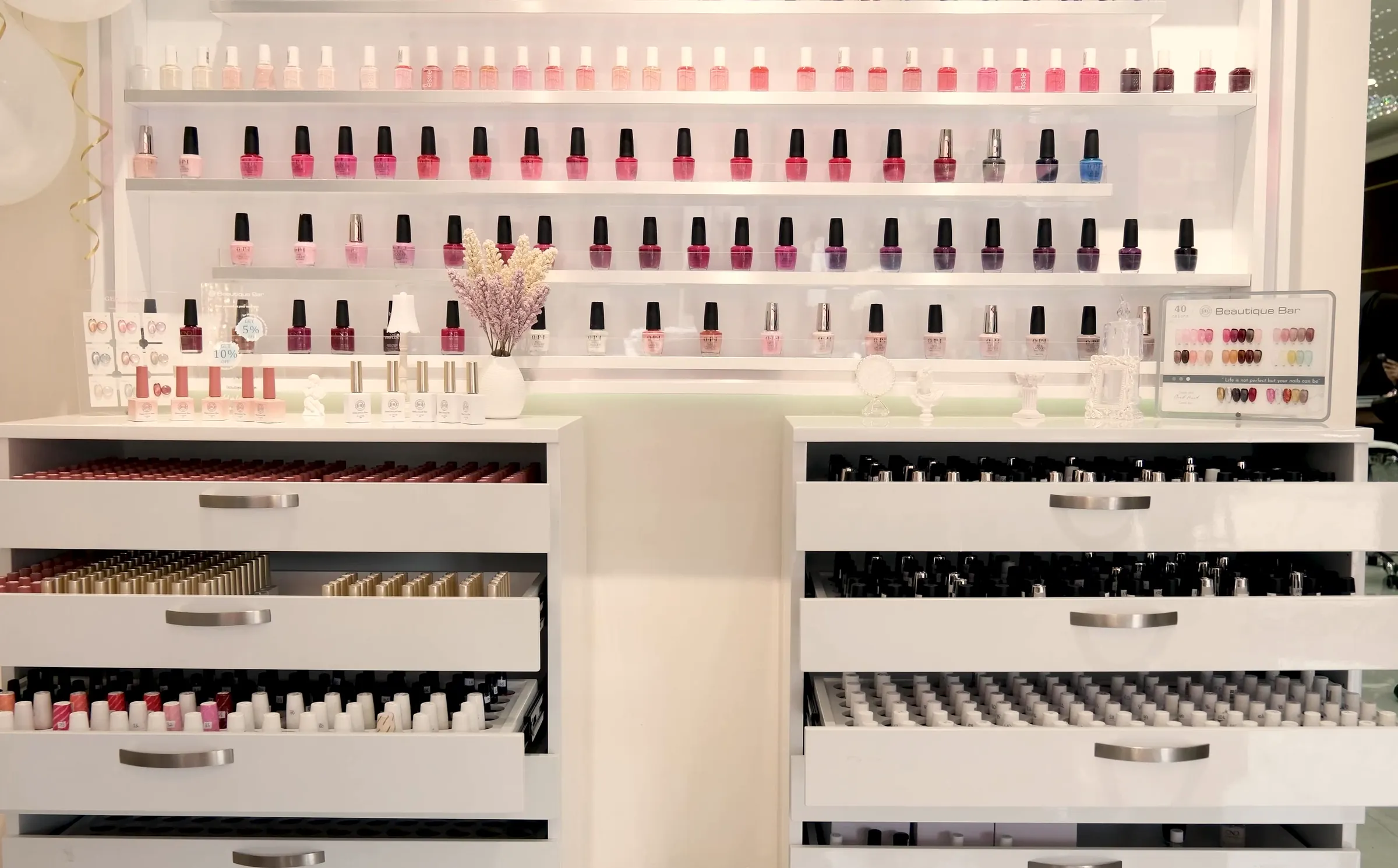 Rows of polish and drawers of colour at Beautique Bar on Yonge