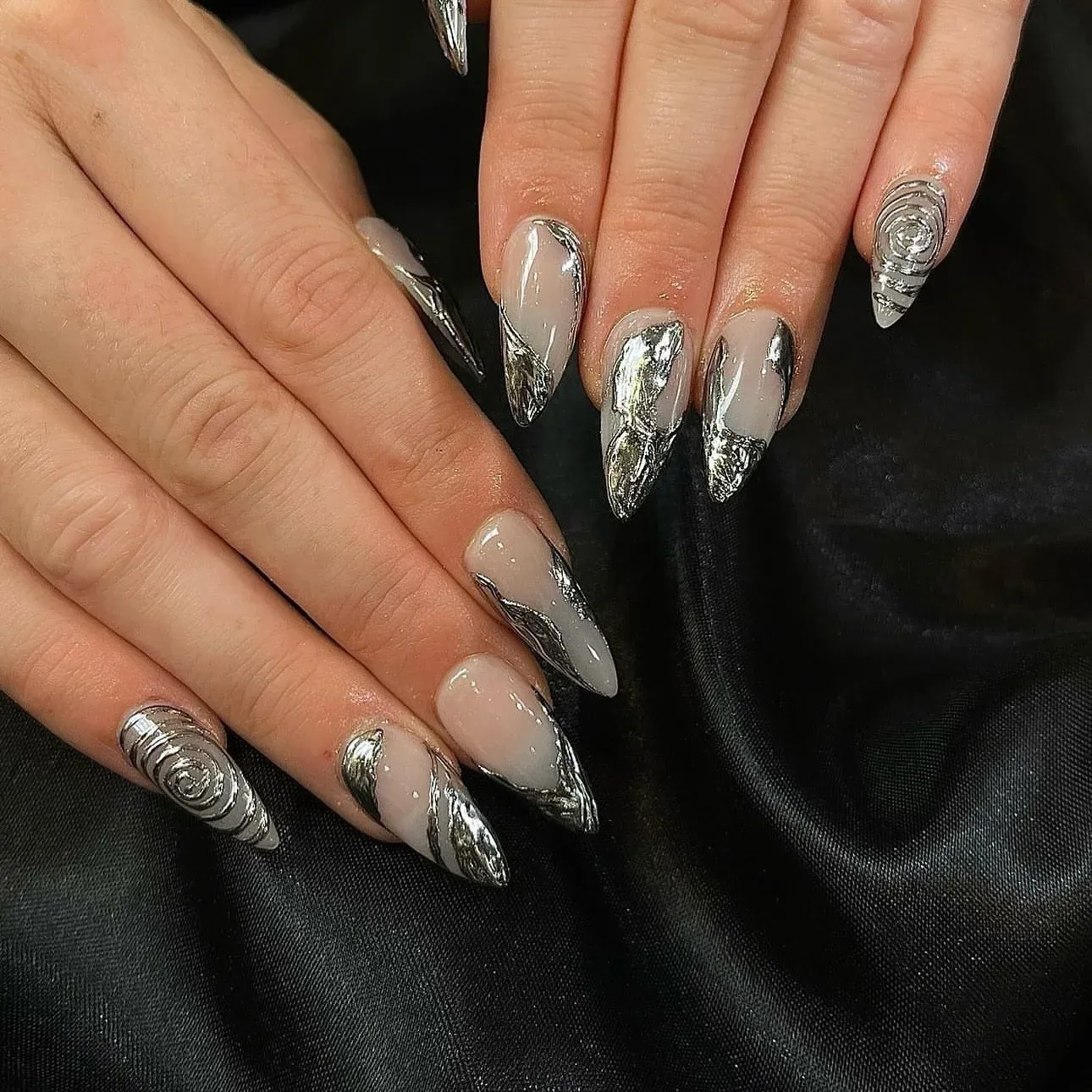 Long sculpted almond nails in silver chrome